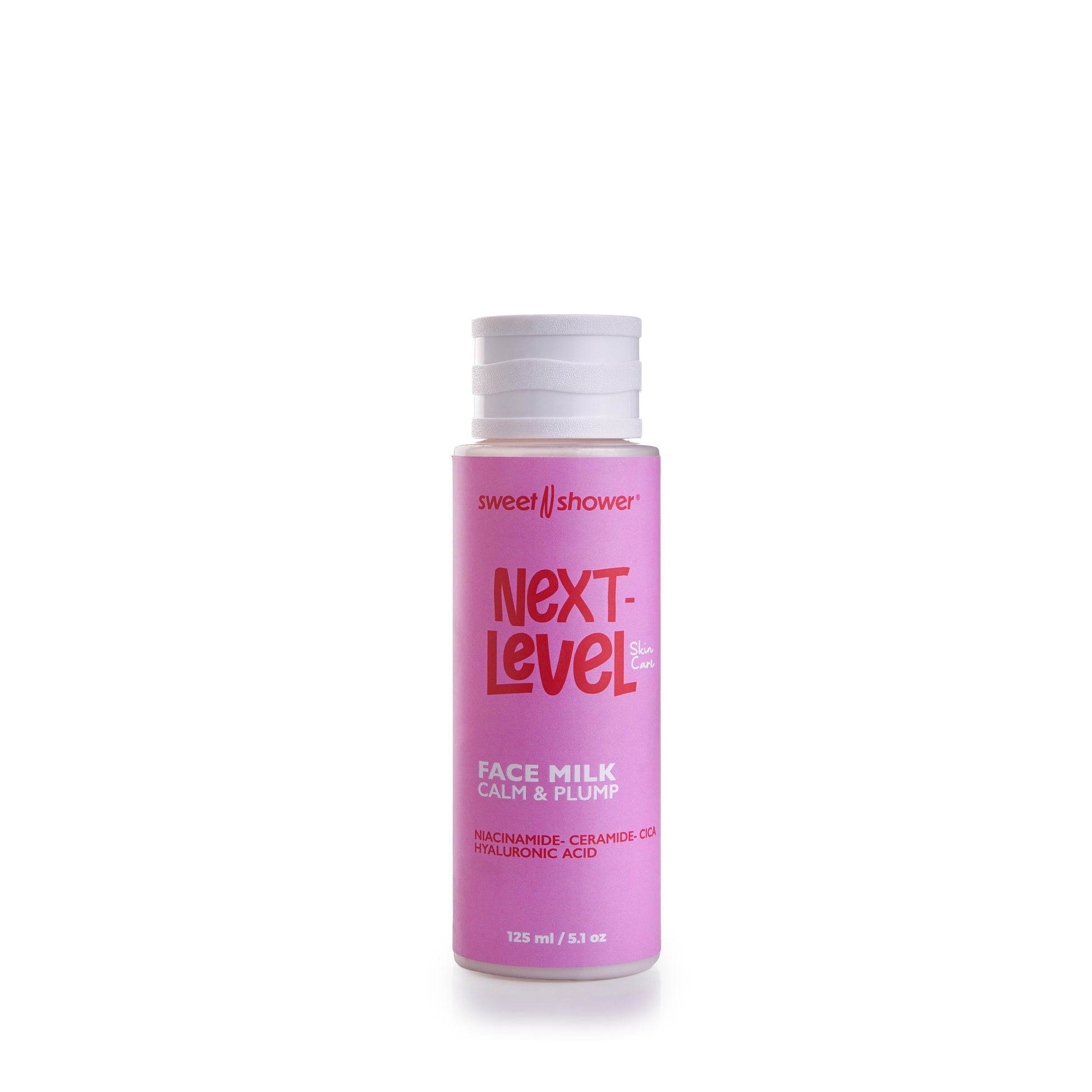 Pink bottle of 'Next-Level Face Milk' with white cap on a white background