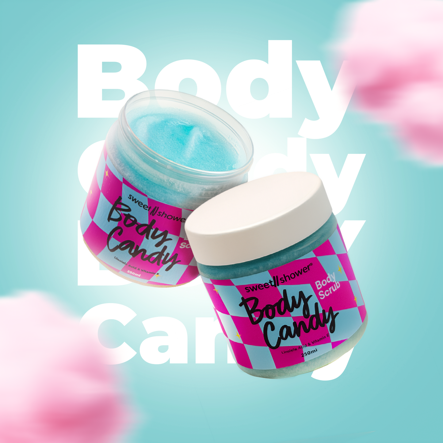 Two jars of 'Body Candy' body scrub on a light blue background with pink flowers.