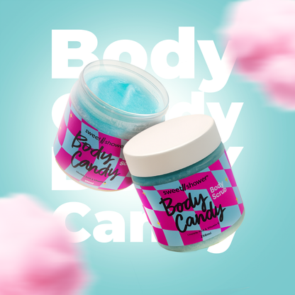 Two jars of 'Body Candy' body scrub on a light blue background with pink flowers.